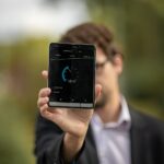 person holding Android tablet computer