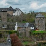 a castle like building with a clock tower on top of it