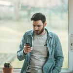 man using his smartphone