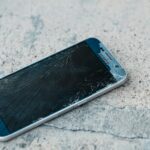 blue samsung android smartphone on gray marble table