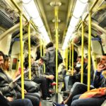 photo of group on people sitting inside train