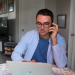 woman in white long sleeve shirt wearing eyeglasses