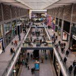 a mall filled with lots of people walking around