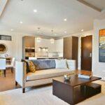 Modern, stylish living room with open concept kitchen.