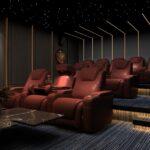 a room filled with red chairs and a table