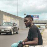a man sitting on a skateboard